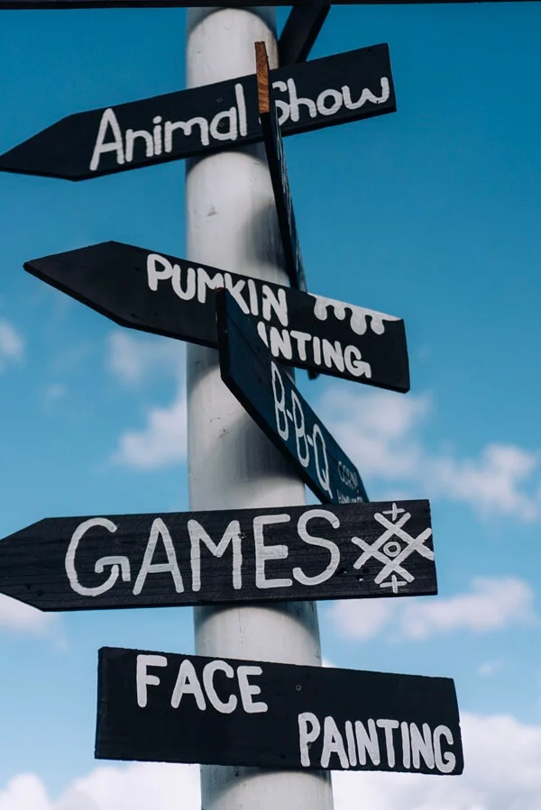 A fun directional sign for a community event.